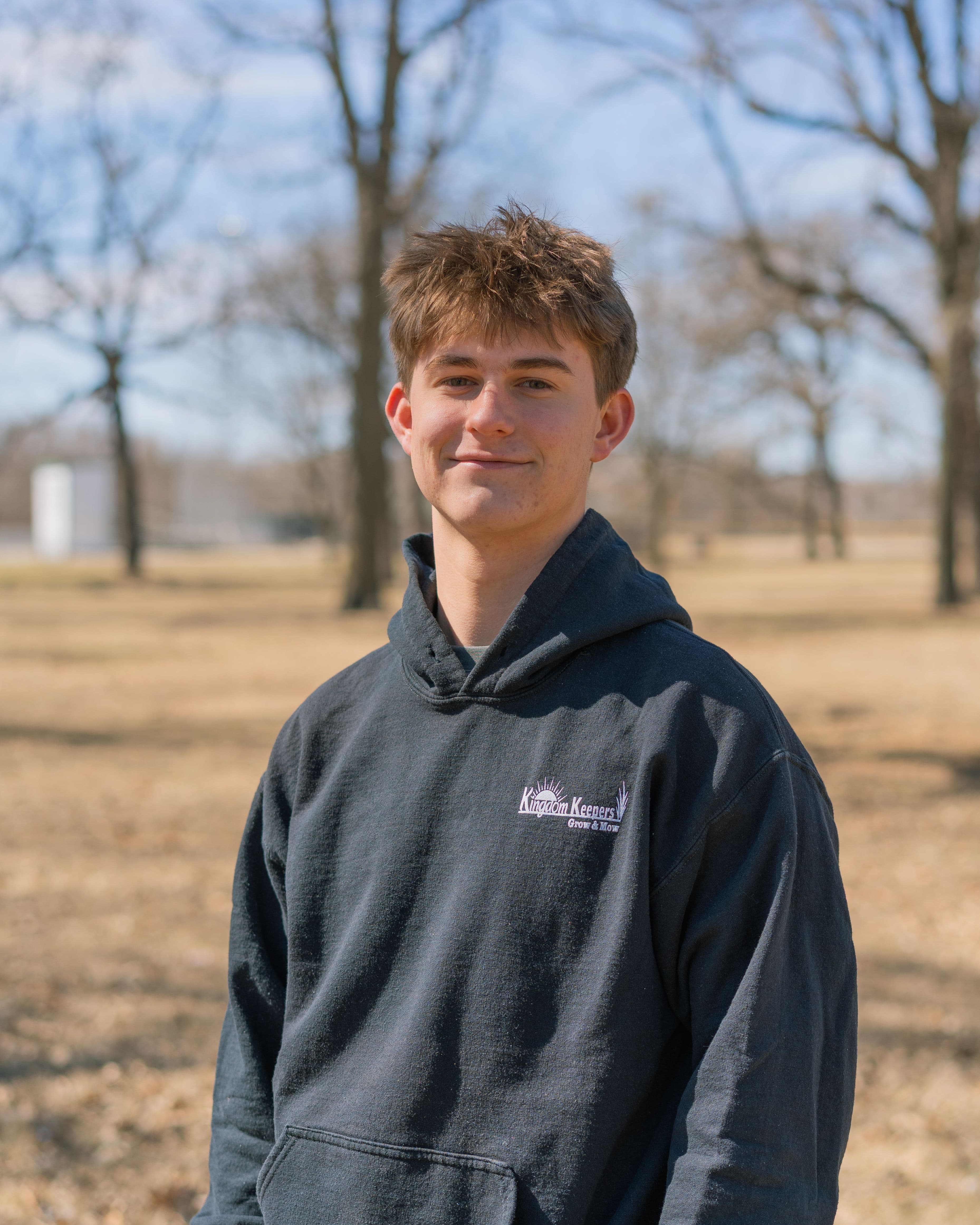 Jude with a green hoodie on