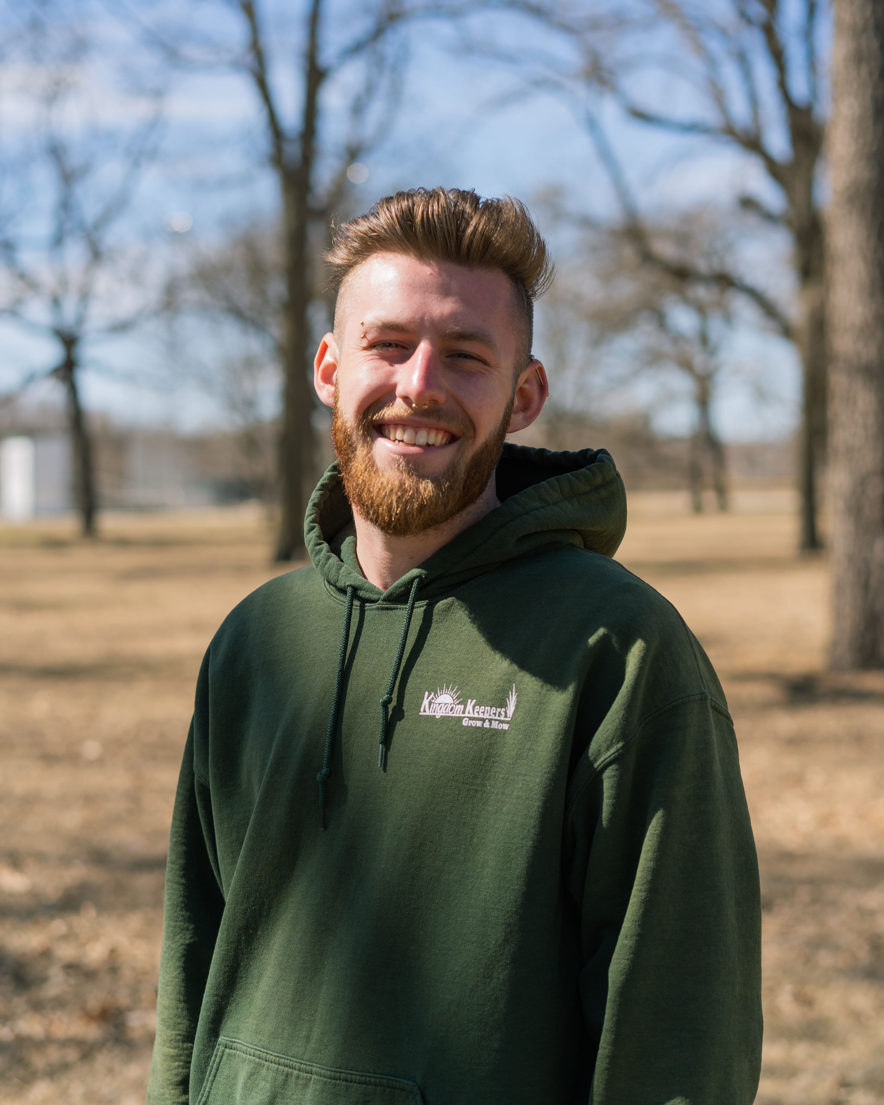 Adam with a green hoodie on
